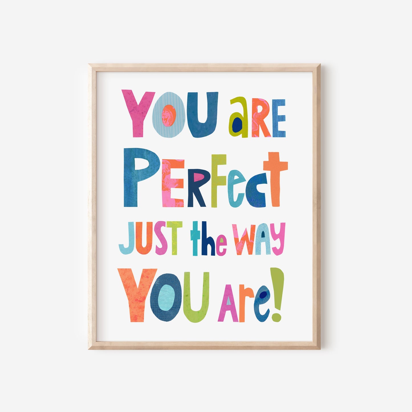 Framed poster with motivational quote 'You are perfect just the way you are!' in colorful letters on a white background.