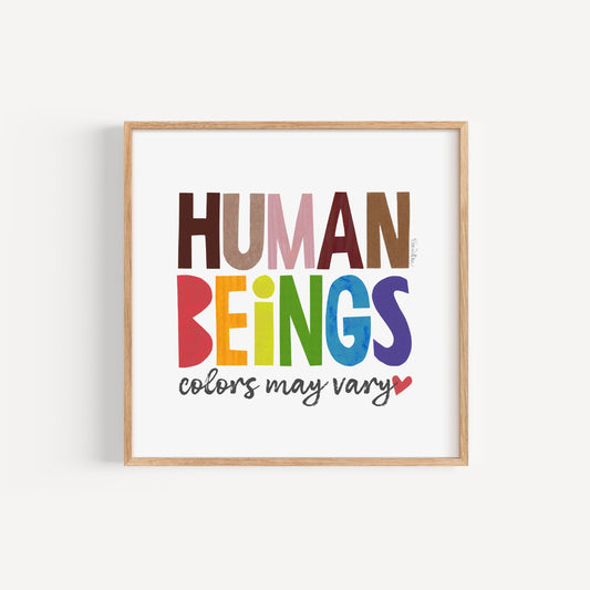Framed artwork with 'Human Beings colors may vary' text in multicolors on a white background